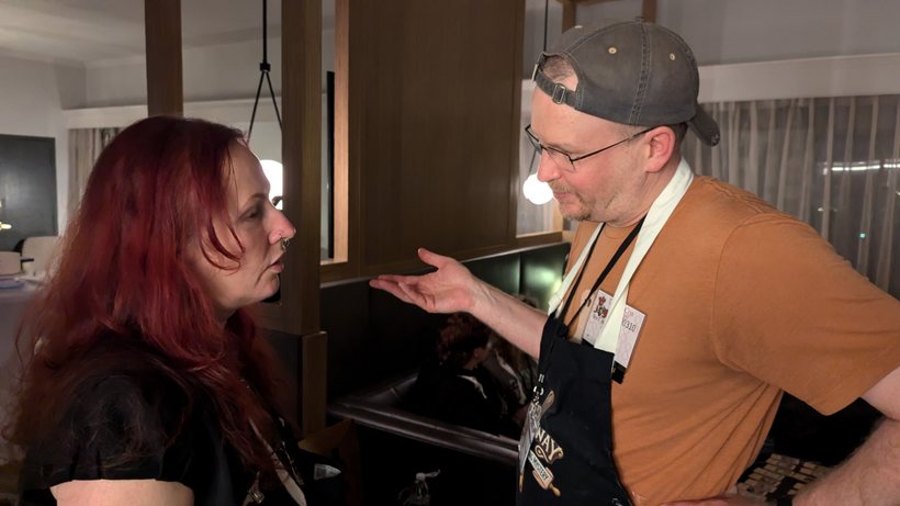 An actor confronting a contestant in character